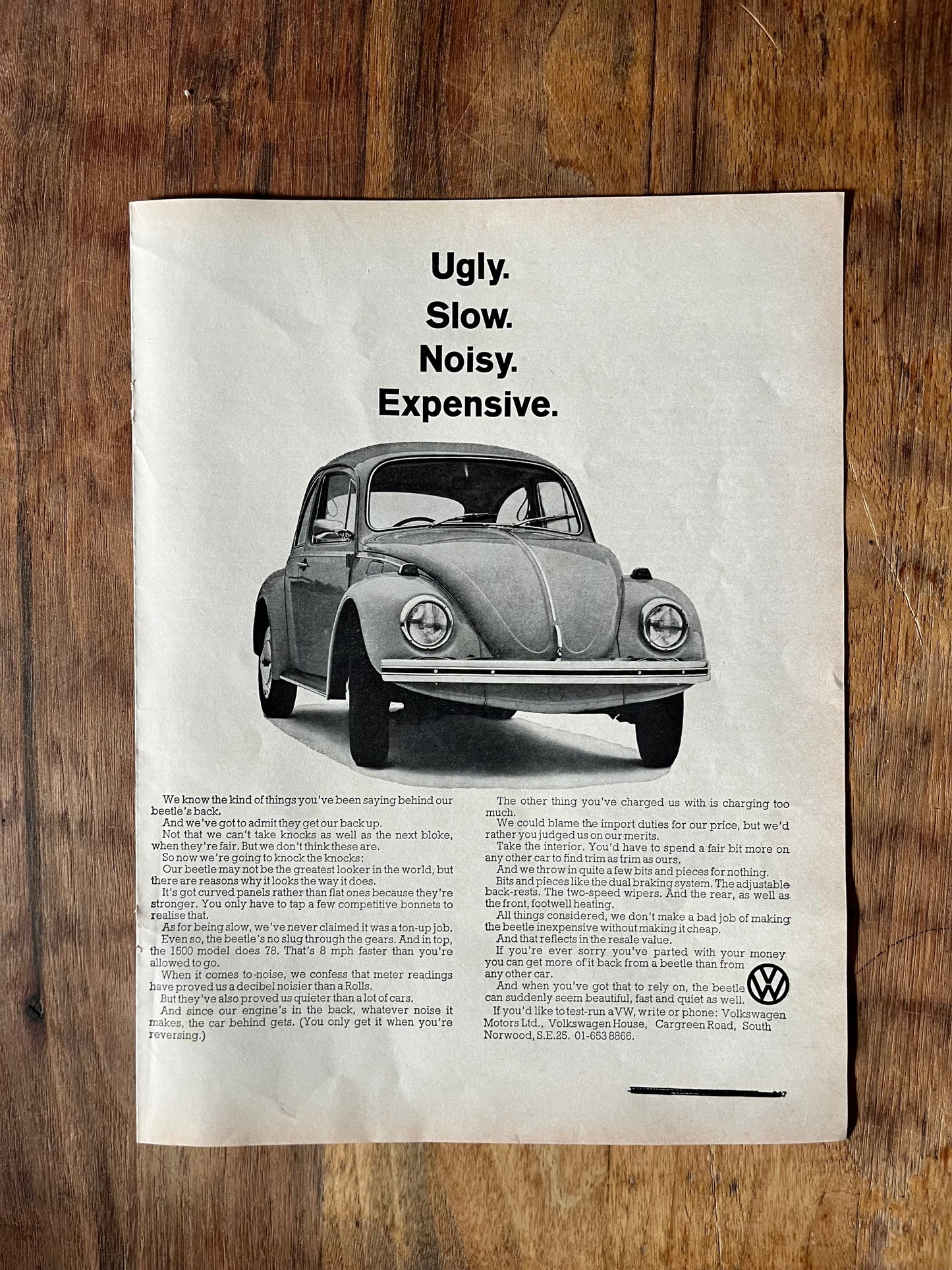 Vintage VW Volkswagen Beetle advertisement. 1968 Ugly, slow, noisy, Expensive