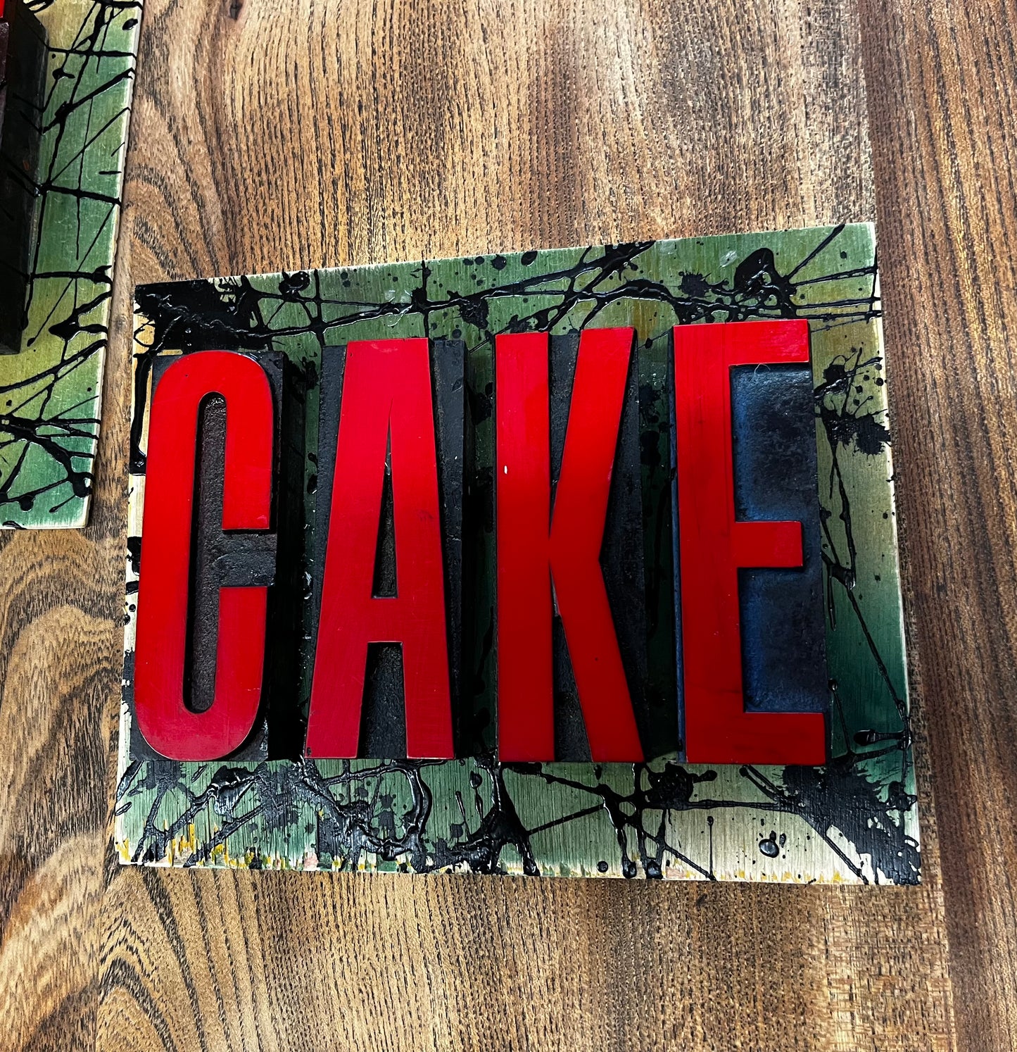“CAKE” artwork from reclaimed Printing blocks