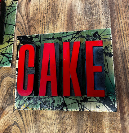 “CAKE” artwork from reclaimed Printing blocks