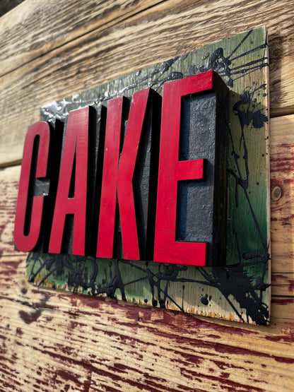 “CAKE” artwork from reclaimed Printing blocks
