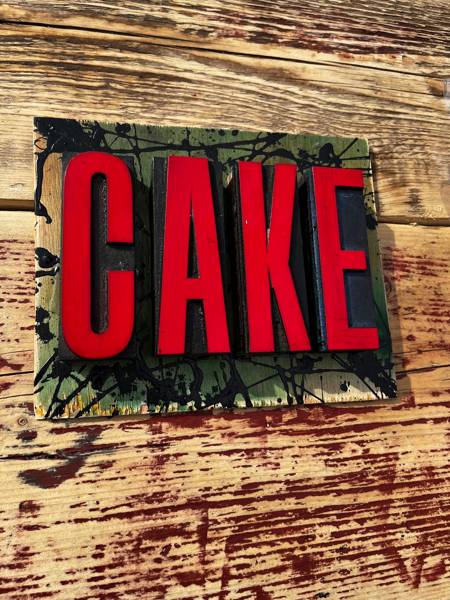 “CAKE” artwork from reclaimed Printing blocks