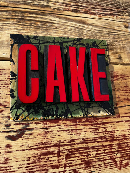 “CAKE” artwork from reclaimed Printing blocks
