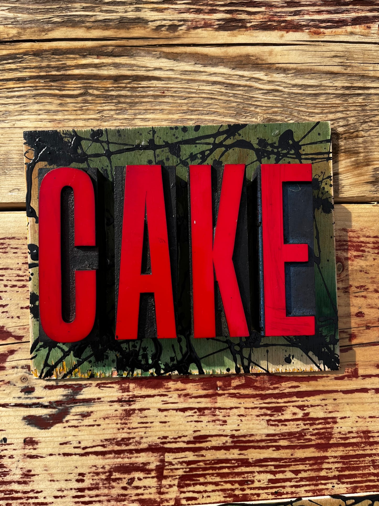 “CAKE” artwork from reclaimed Printing blocks