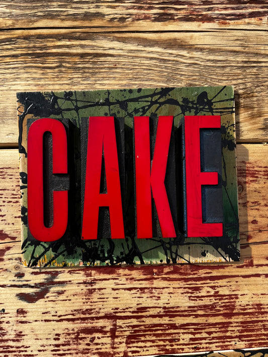 “CAKE” artwork from reclaimed Printing blocks