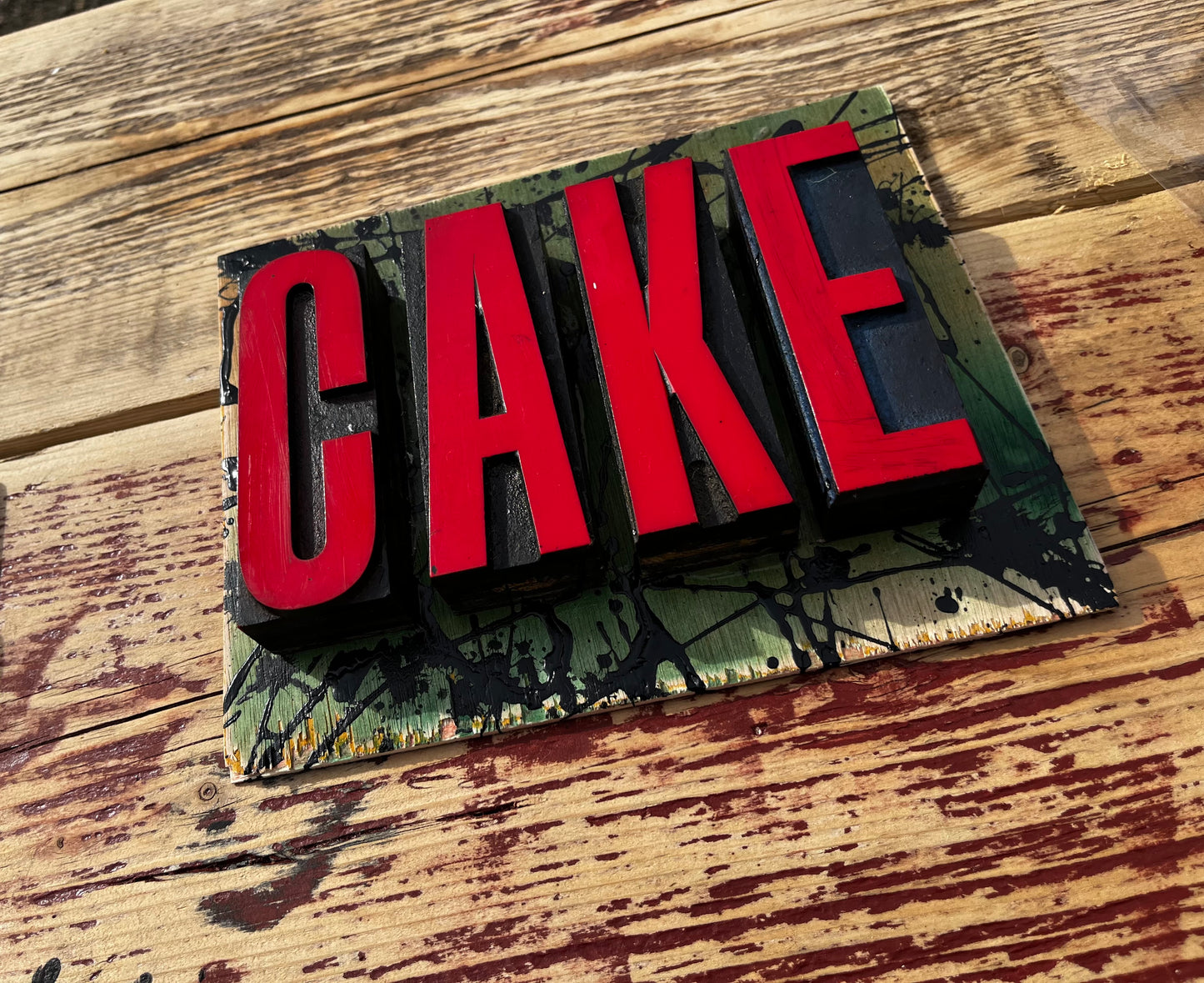 “CAKE” artwork from reclaimed Printing blocks