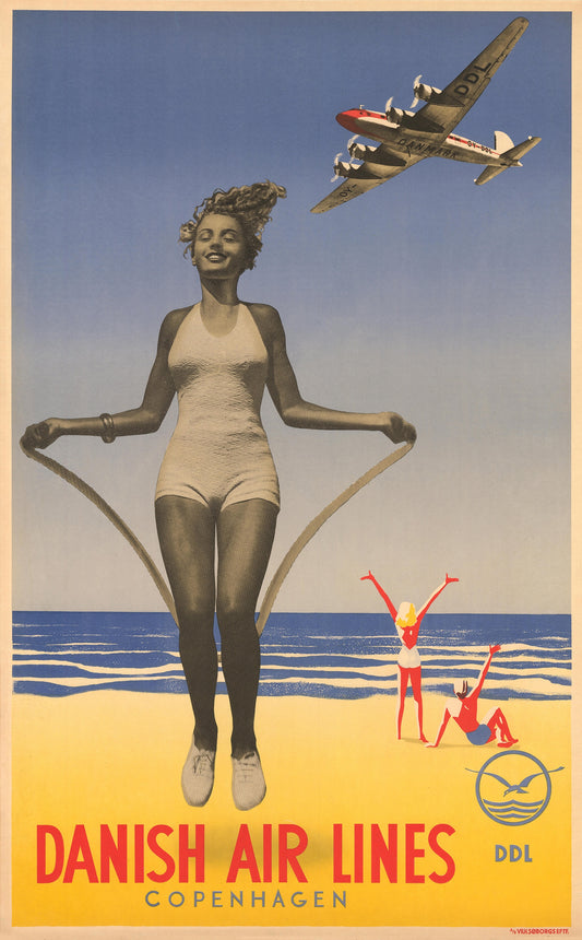 A smiling woman skips on a sunny beach beneath a silver airliner, with red Danish Air Lines lettering below.