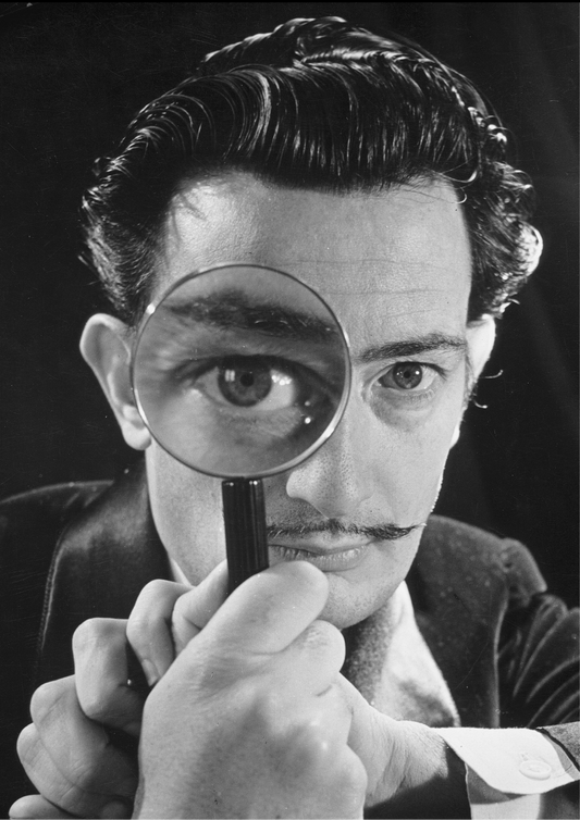 Salvador Dali portrait with a magnifying glass -Philippe Halsmann