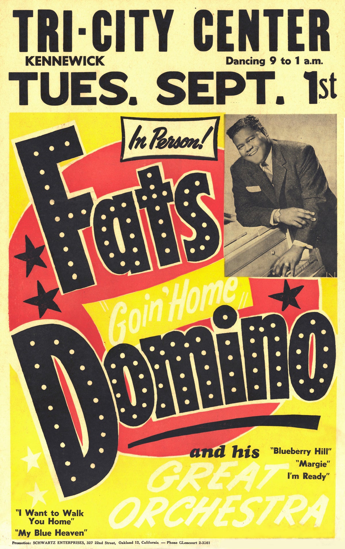 Bold black and red lettering surrounds a photograph of Fats Domino at the piano on a bright yellow concert bill for Kennewick