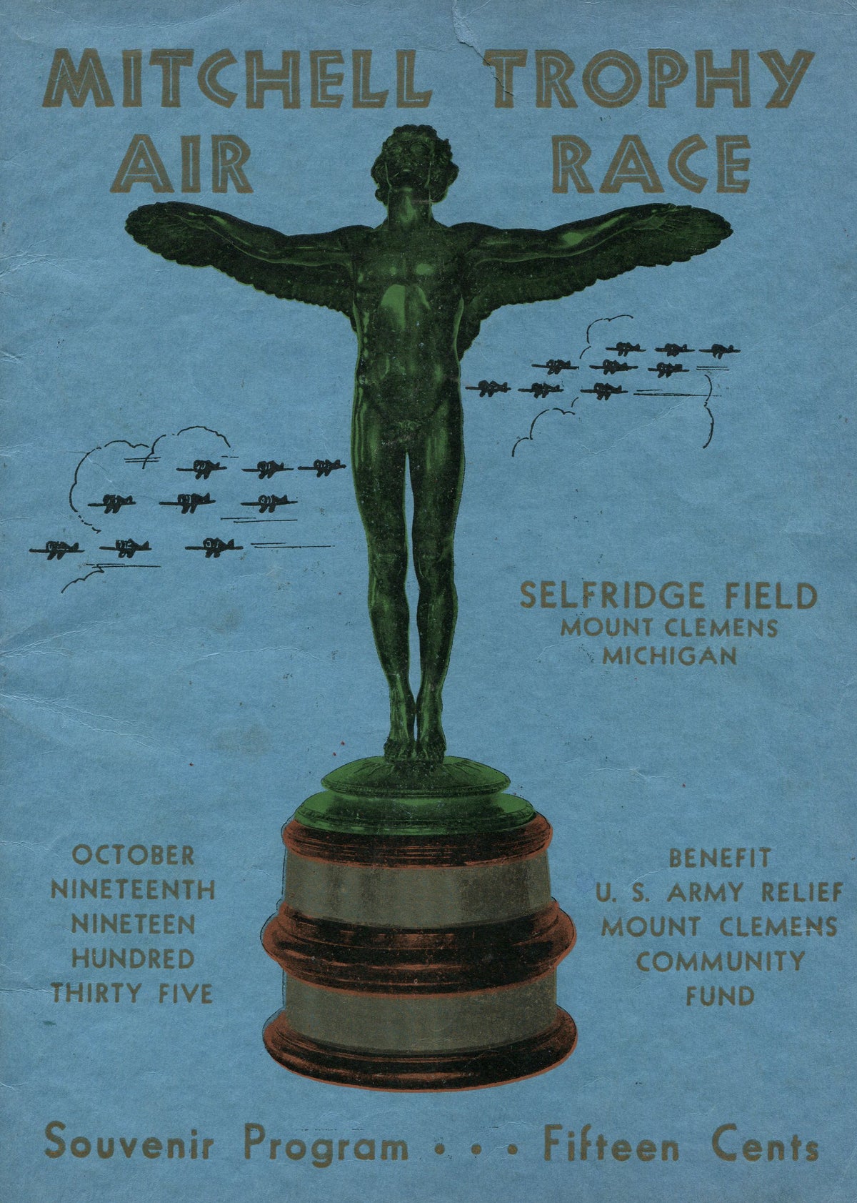 A winged trophy stands before formations of aircraft on a blue souvenir programme for the 1935 Mitchell Trophy Air Race.