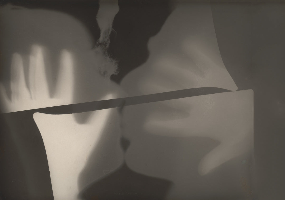 A horizontal dark band divides soft grey shapes and a glowing hand silhouette in a landscape-format composition.